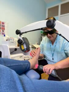 Gillian Gibson delivering laser therapy at Totally Podiatry Langport
