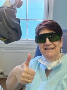 Gill Gibson with the laser therapy equipment at Totally Podiatry Langport